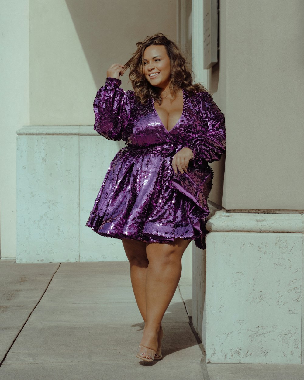 a woman wearing a purple dress