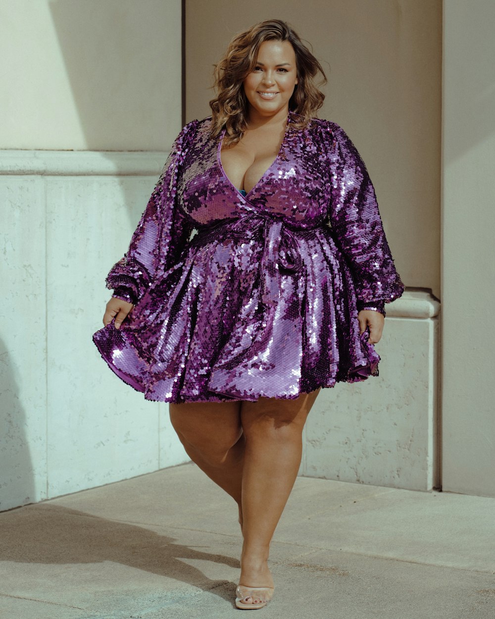 a woman wearing a purple dress