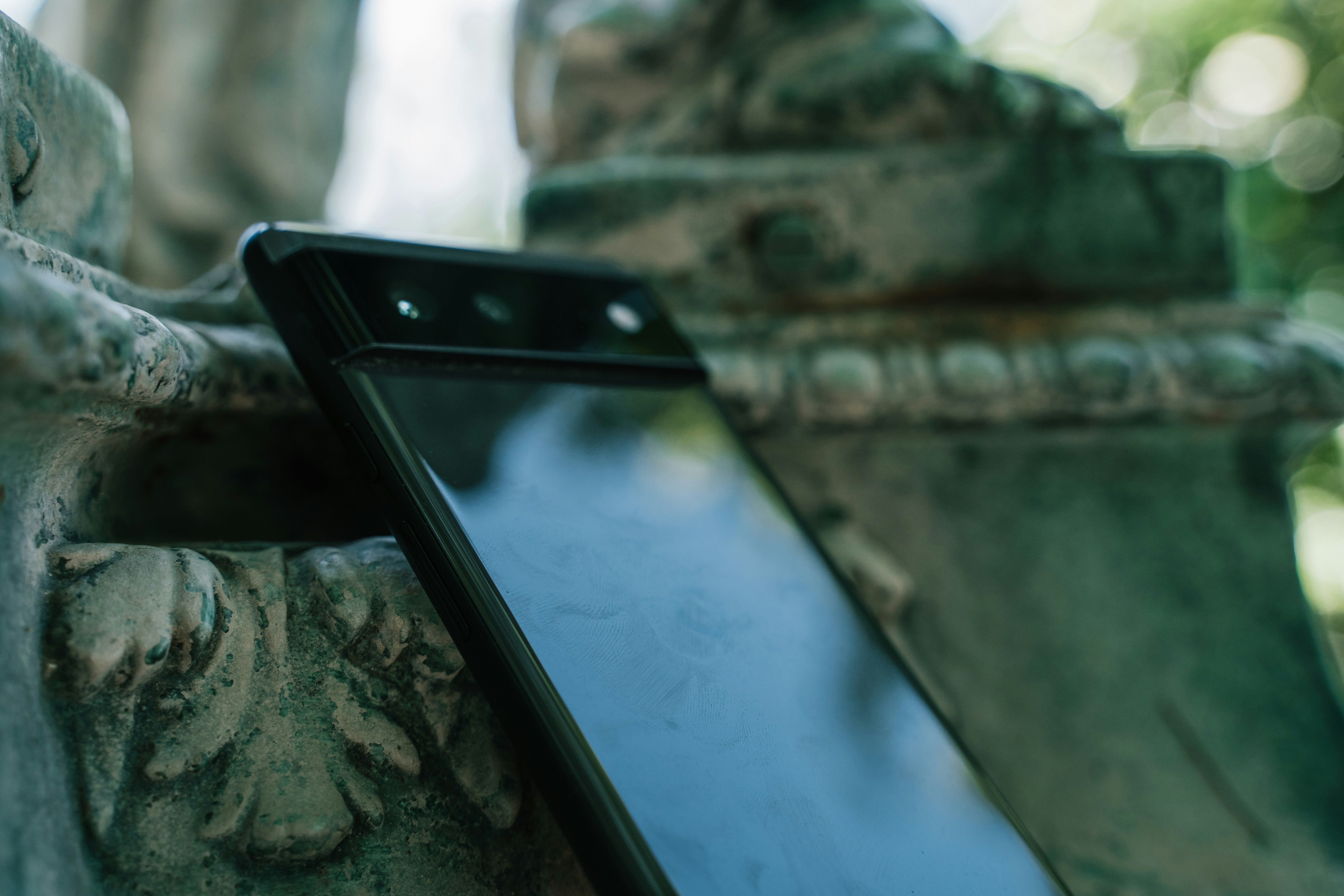 a cell phone on a tree branch
