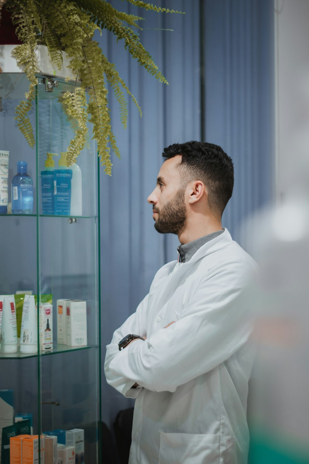 a man wearing a white coat