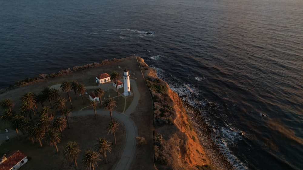 a beach with a lighthouse