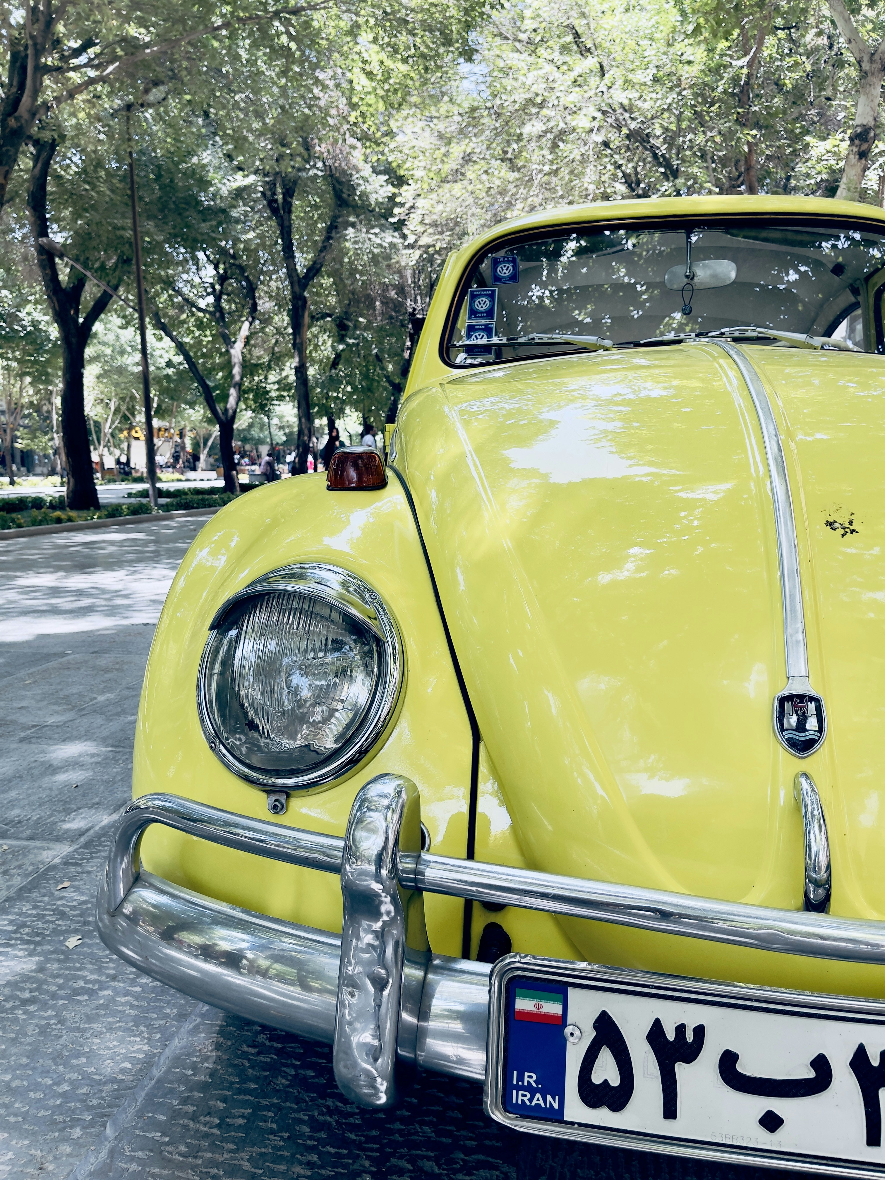 A yellow car parked on the side of the road photo – Free Yellow Image ...