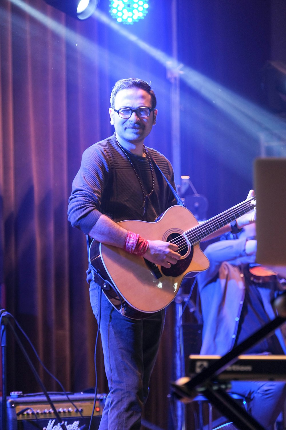 a man playing a guitar