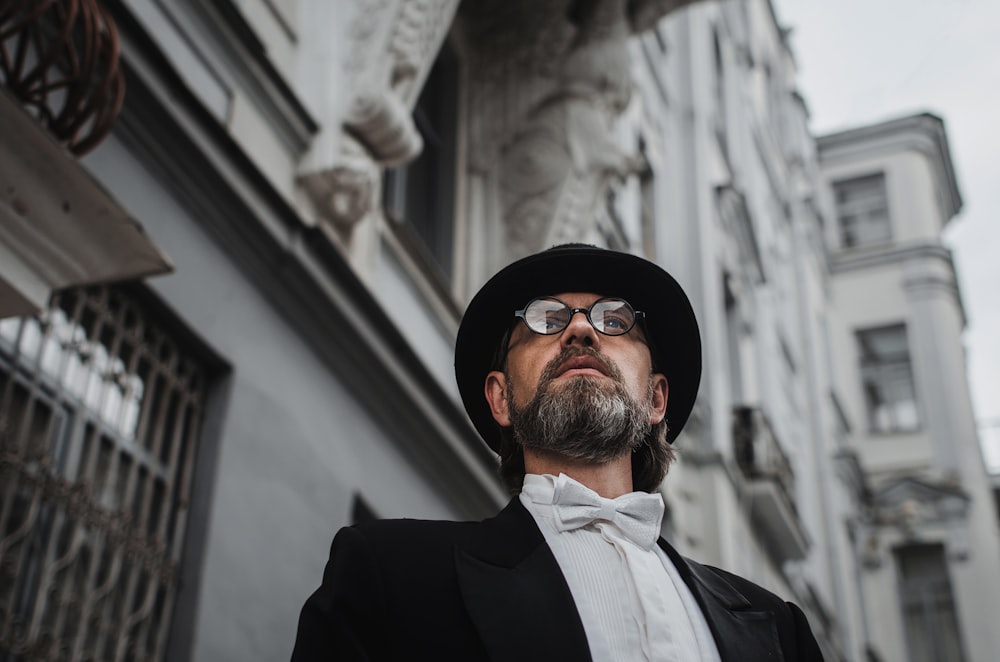 a man wearing a hat and sunglasses