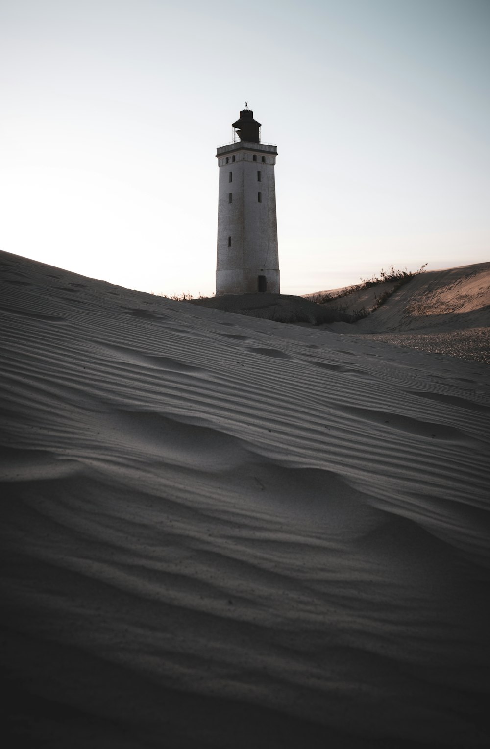 a lighthouse on a hill