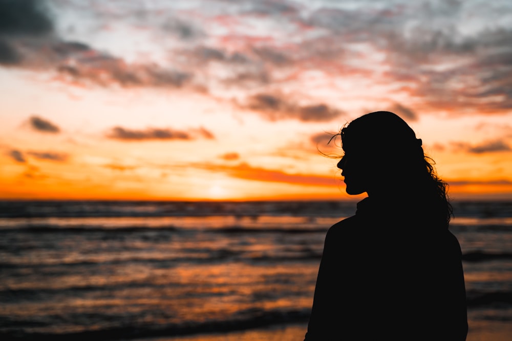 a person looking at the sunset