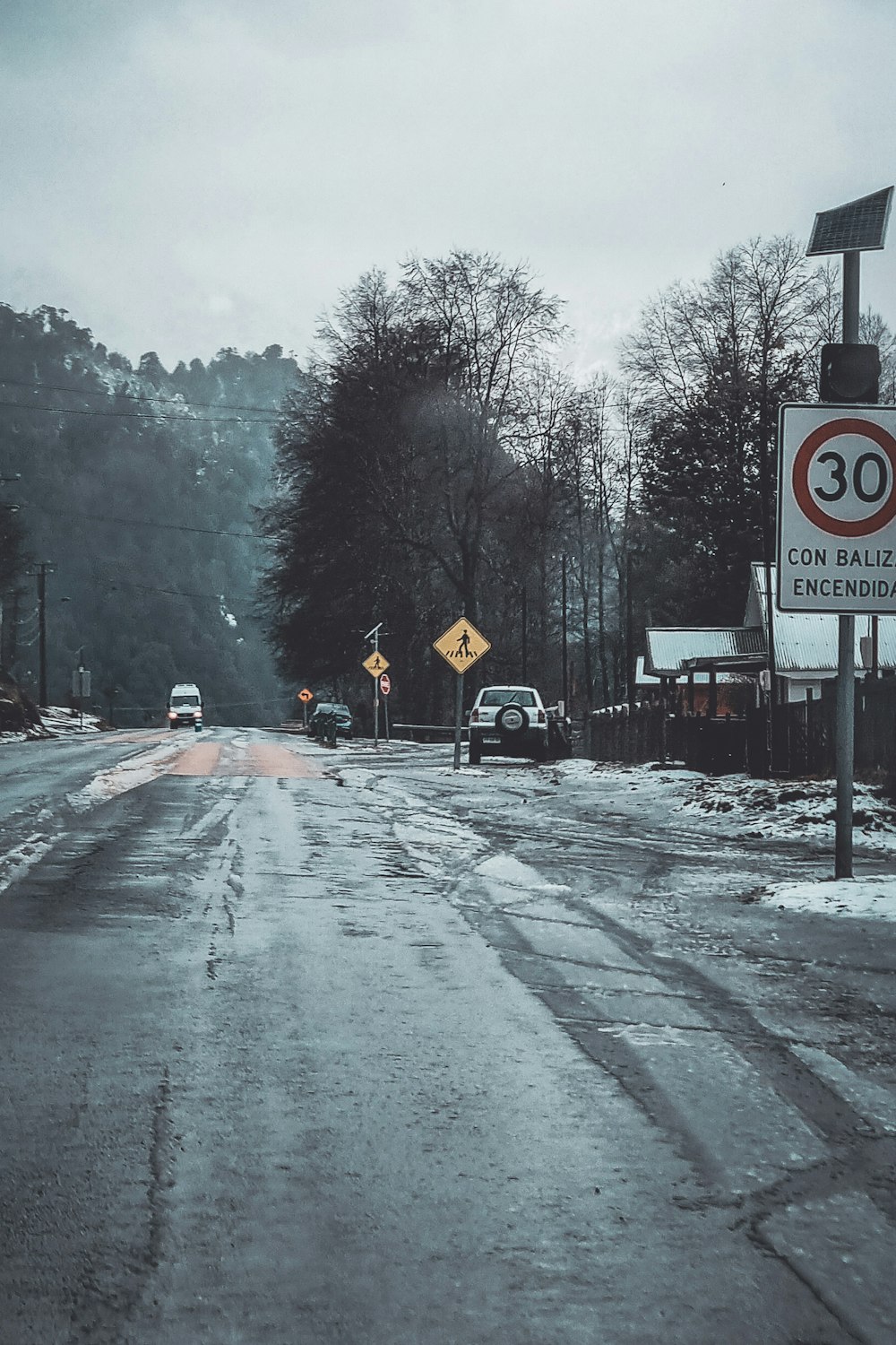 a road with snow on the side