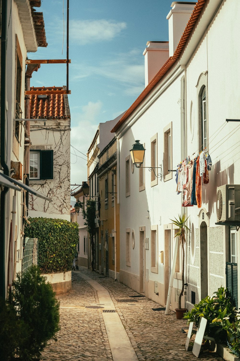 a narrow street with buildings on both sides