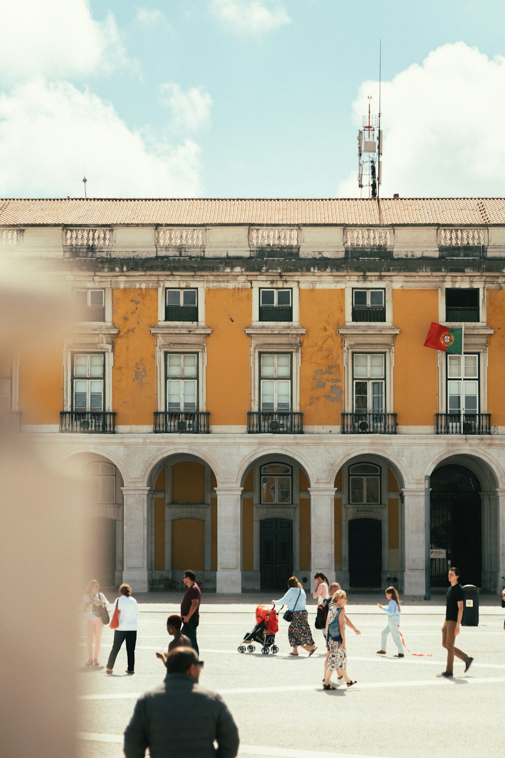 a group of people walking outside of a building