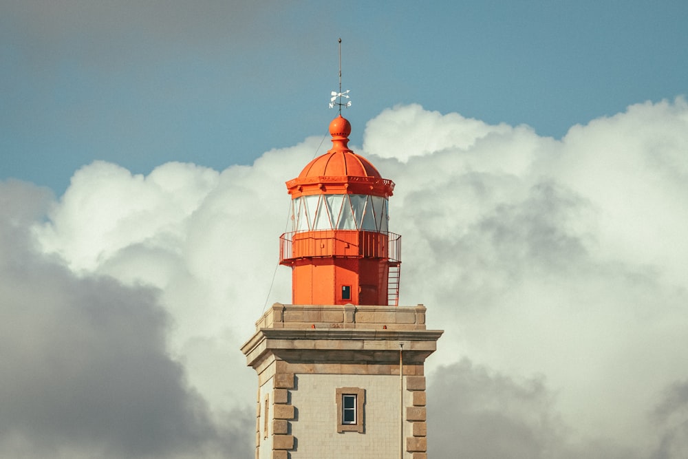 a large clock tower sitting under a cloudy sky