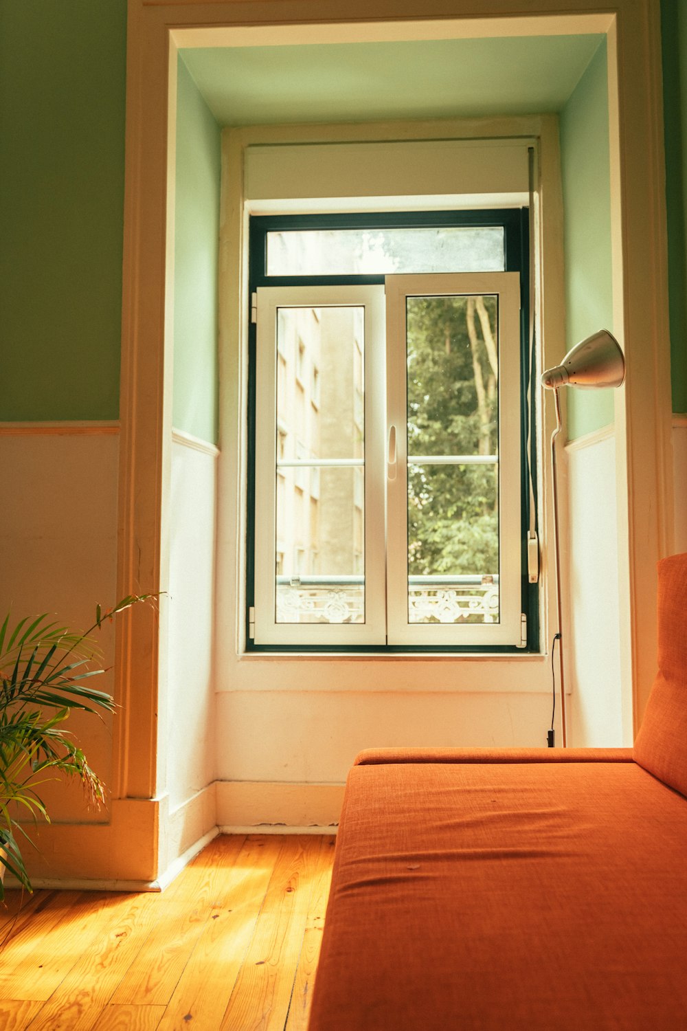 a bedroom with a large window