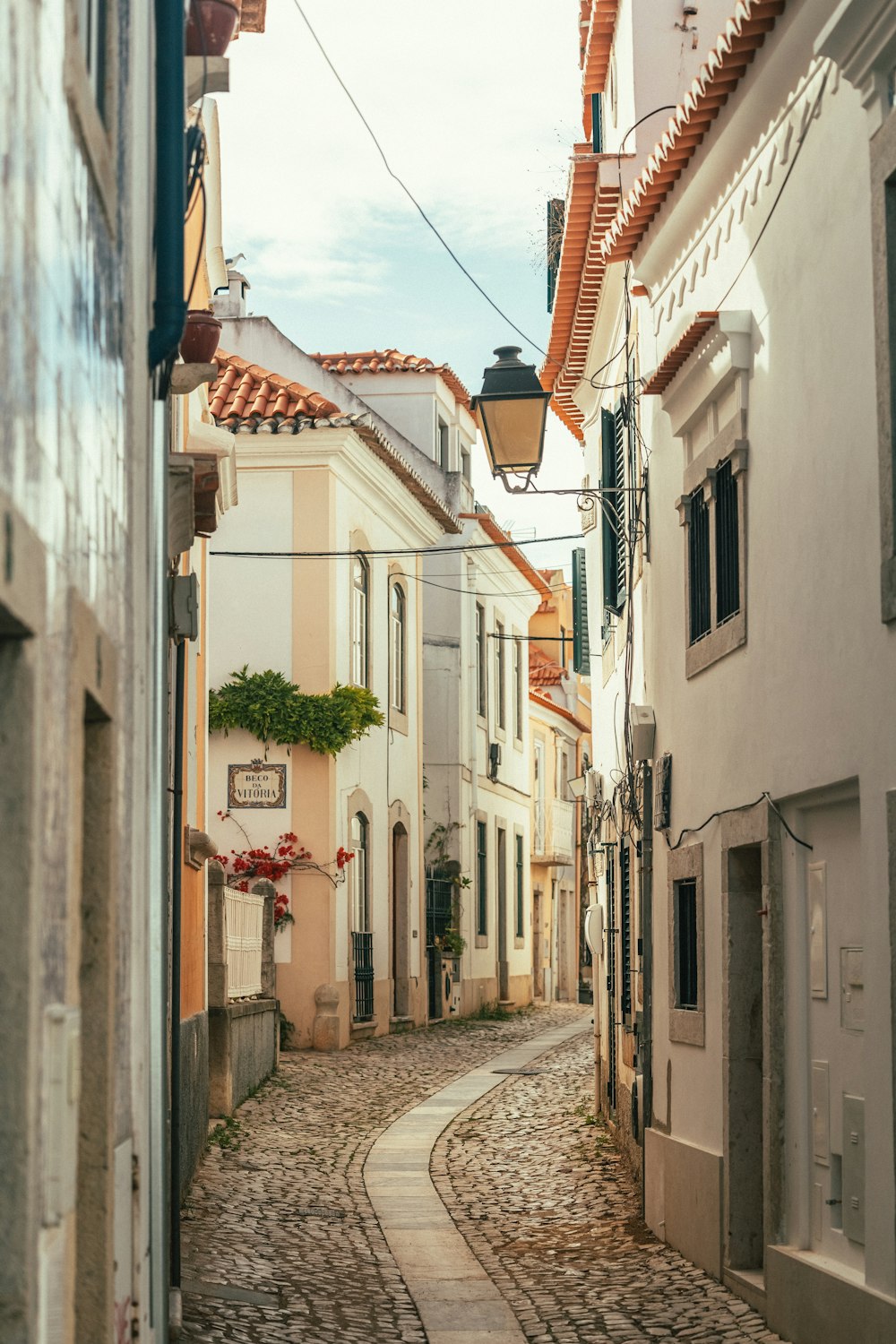 a narrow street with buildings on both sides