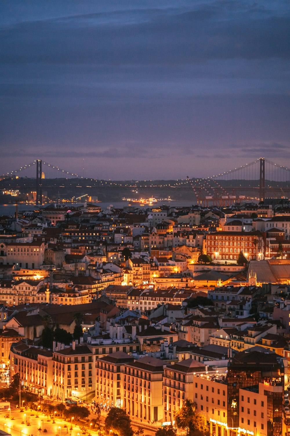 a city with a bridge in the background