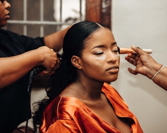 a woman getting her hair done