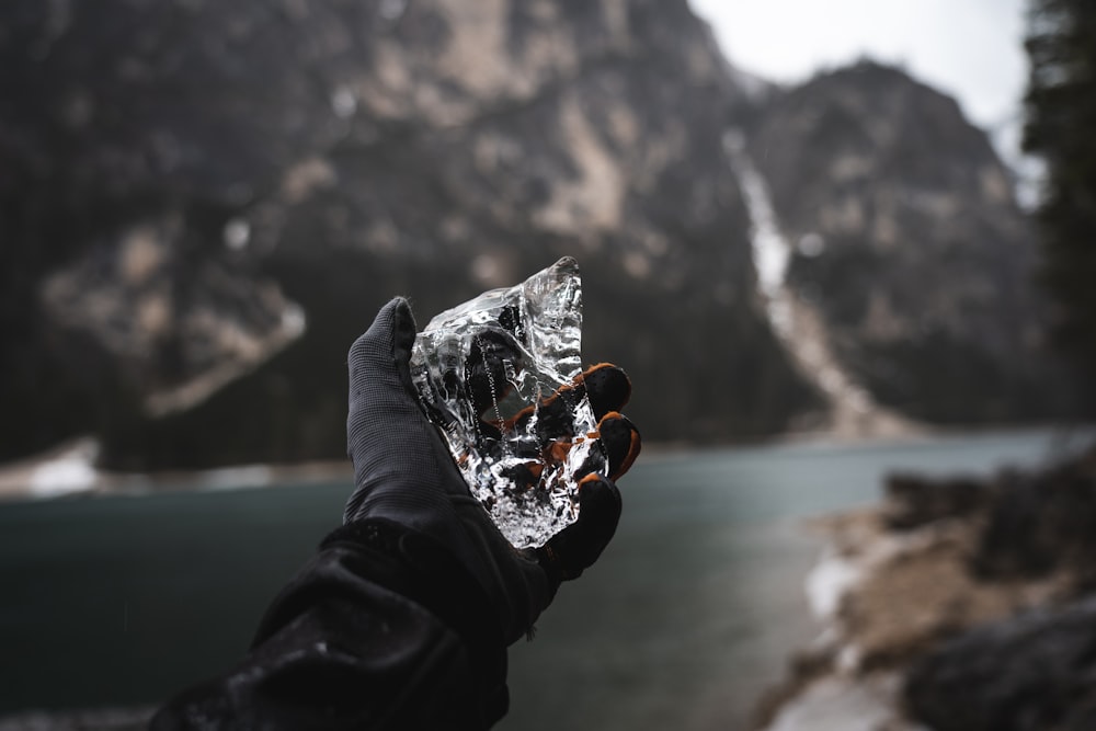 a person holding a foil wrapped object