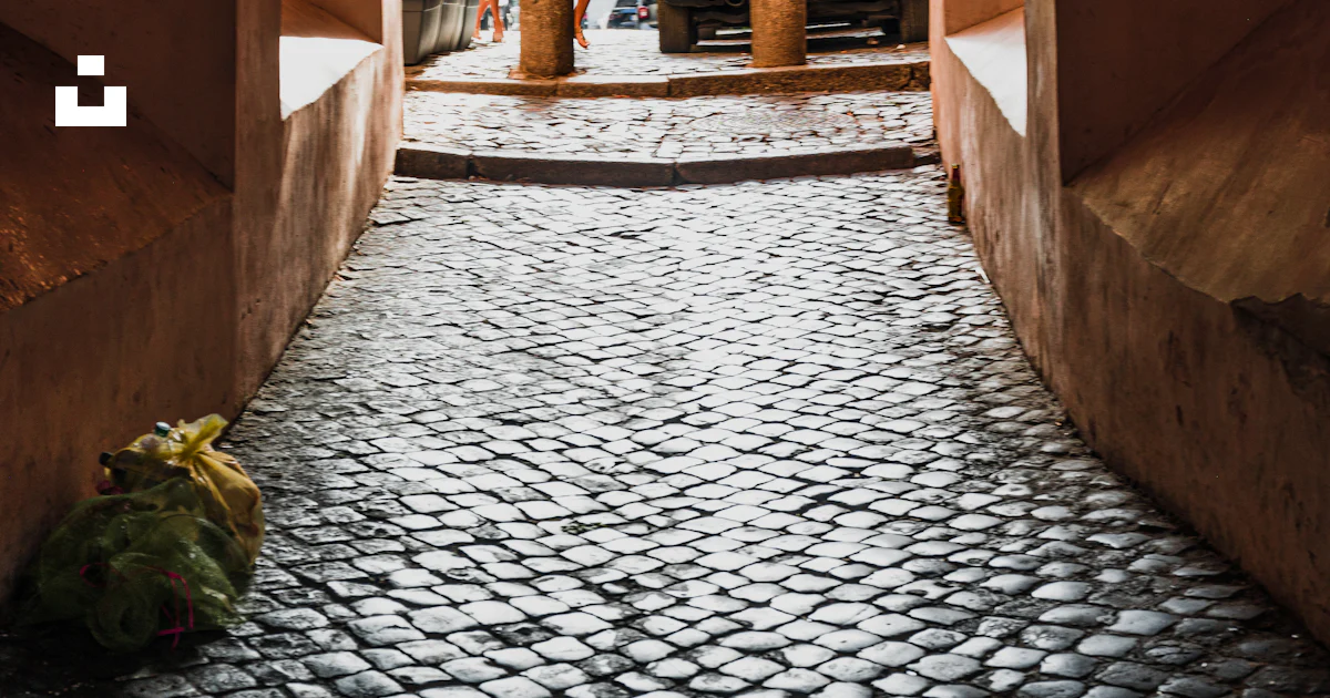 Stone Path Rome A stone walkway with a car parked in the middle photo – Free ...