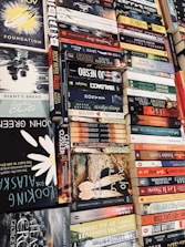 A stack of diverse books with vibrant covers, inviting readers to explore new stories.