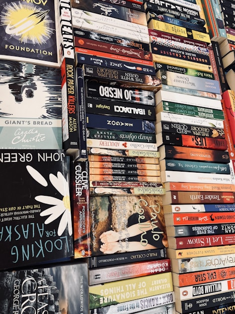 A vibrant banner showcasing various book covers with a modern design.