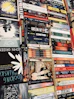 An array of awarded books displayed on a wooden table, representing diverse voices.
