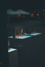 Elegant bottles of Arabian perfumes displayed on a wooden table with soft lighting