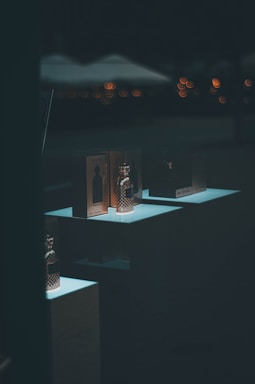 An elegant display of car perfumes arranged on a stylish shelf with soft natural light.