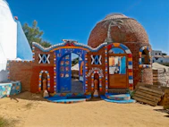 a colorful building with a blue roof