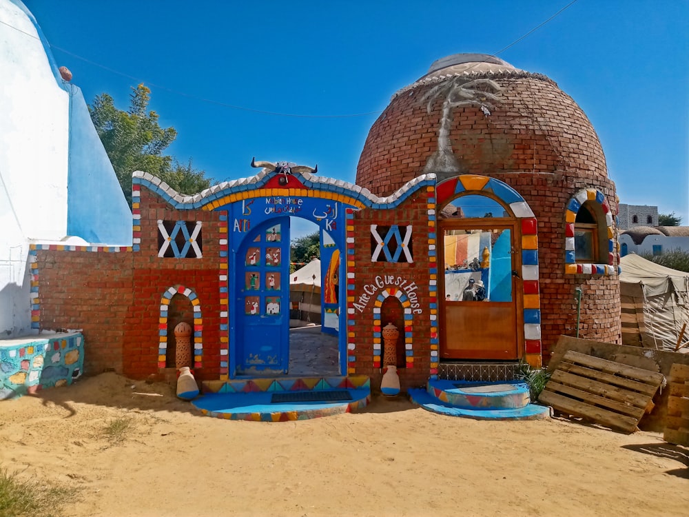 a colorful building with a blue roof