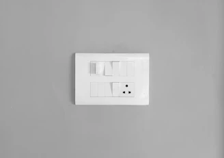 a white square object with a black and white logo on it