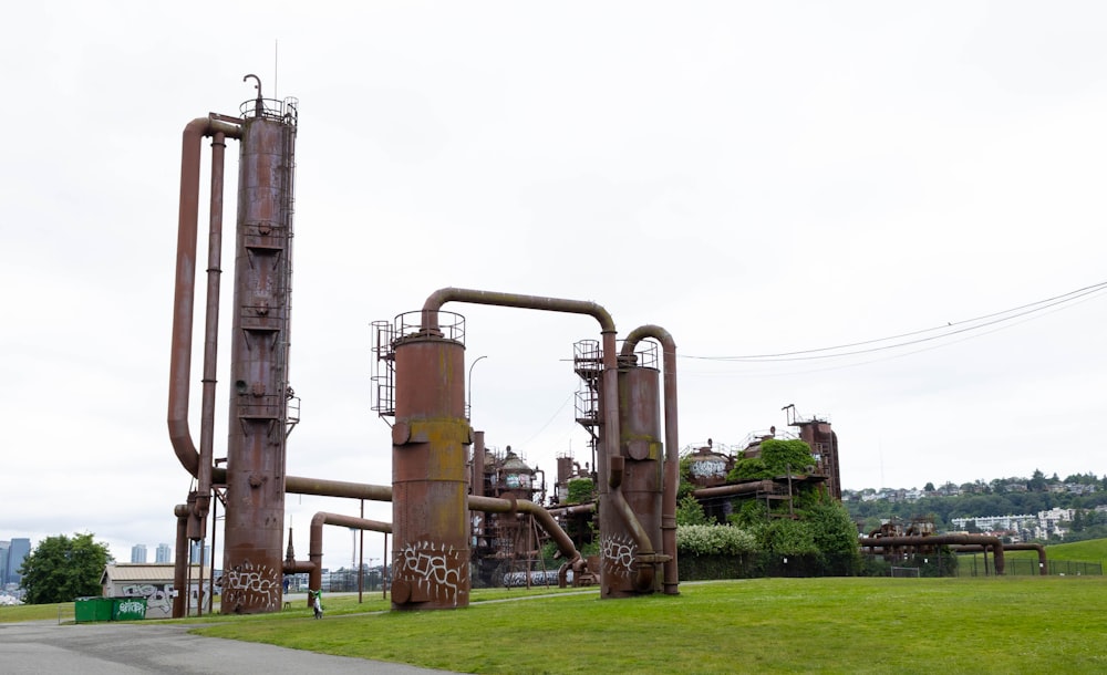 a group of metal structures with Gas Works Park in the background