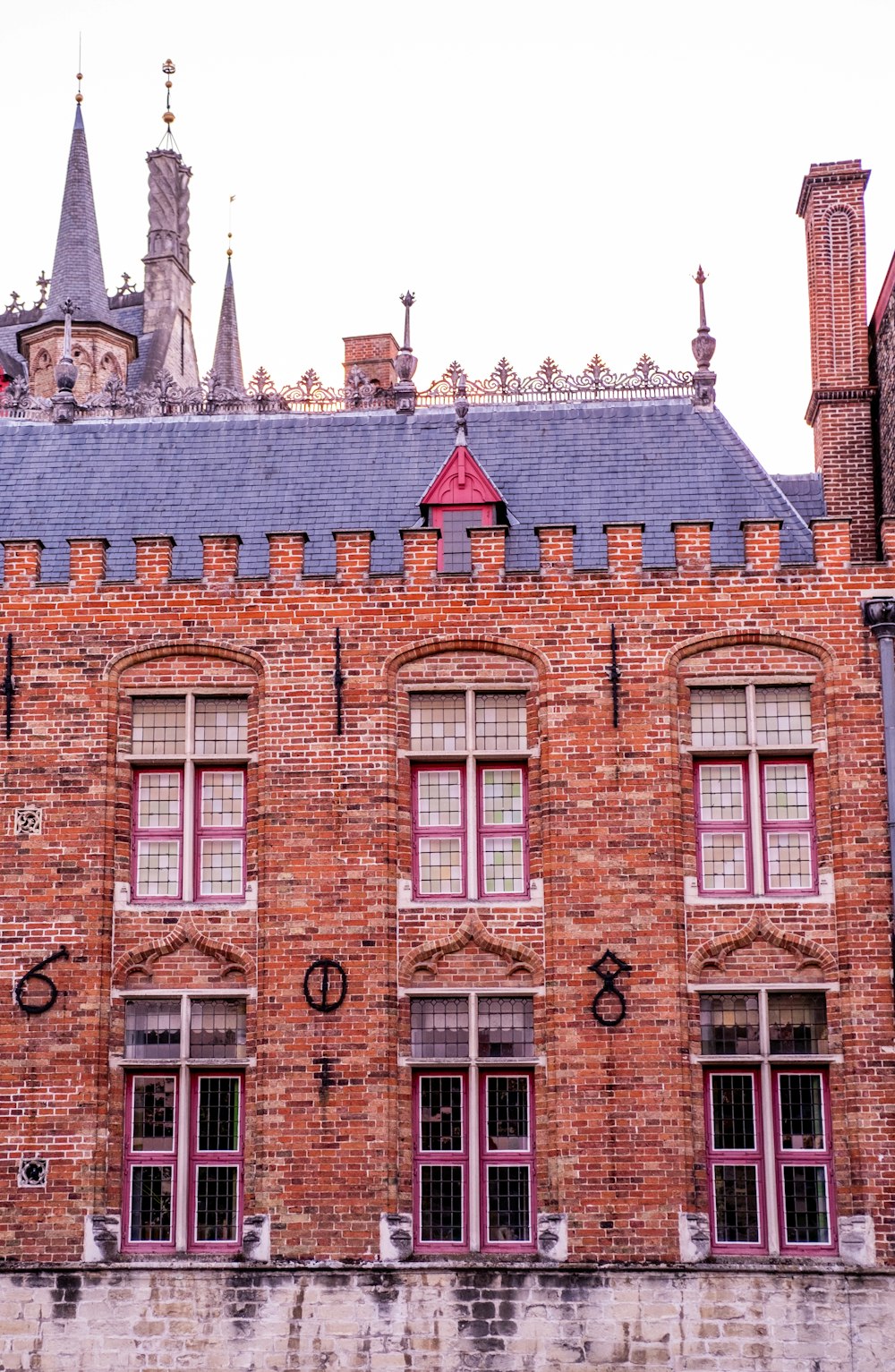 a brick building with a blue roof