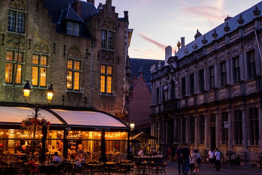 a group of people walking around a town square