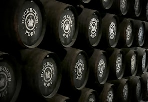 Artisanal wine barrels stacked in a traditional Portuguese cellar