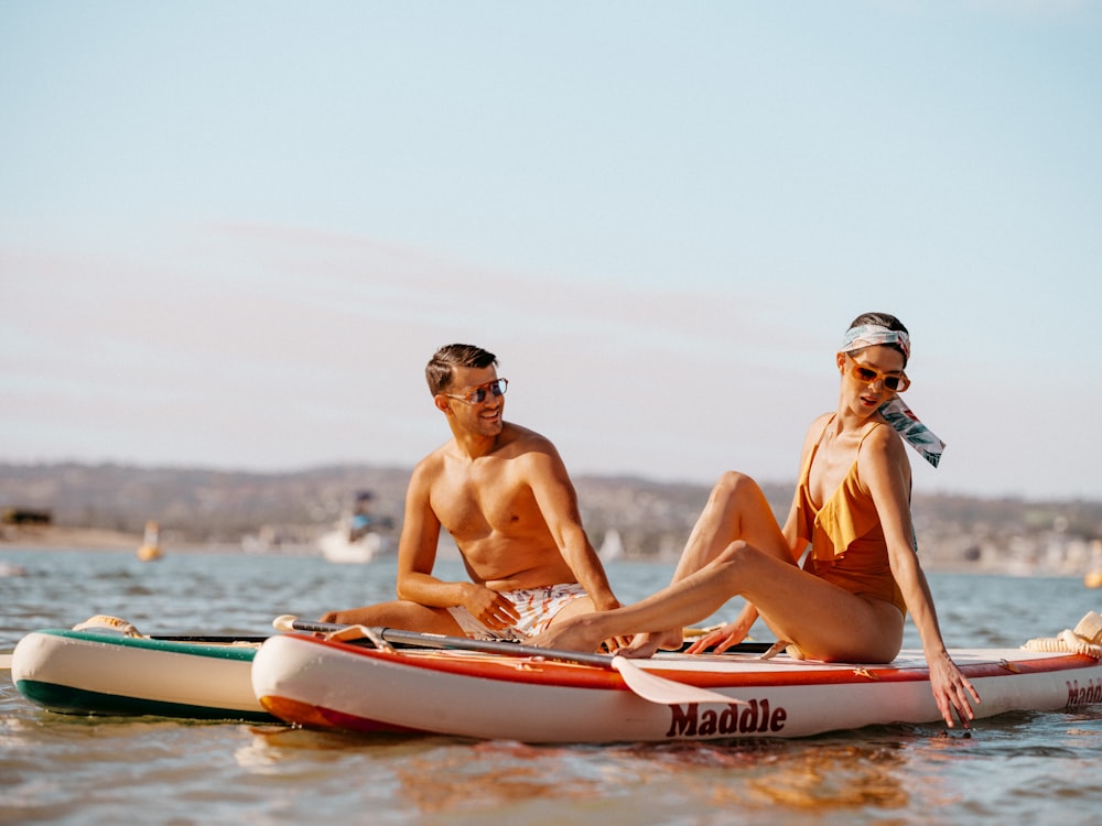 a man and woman on a boat