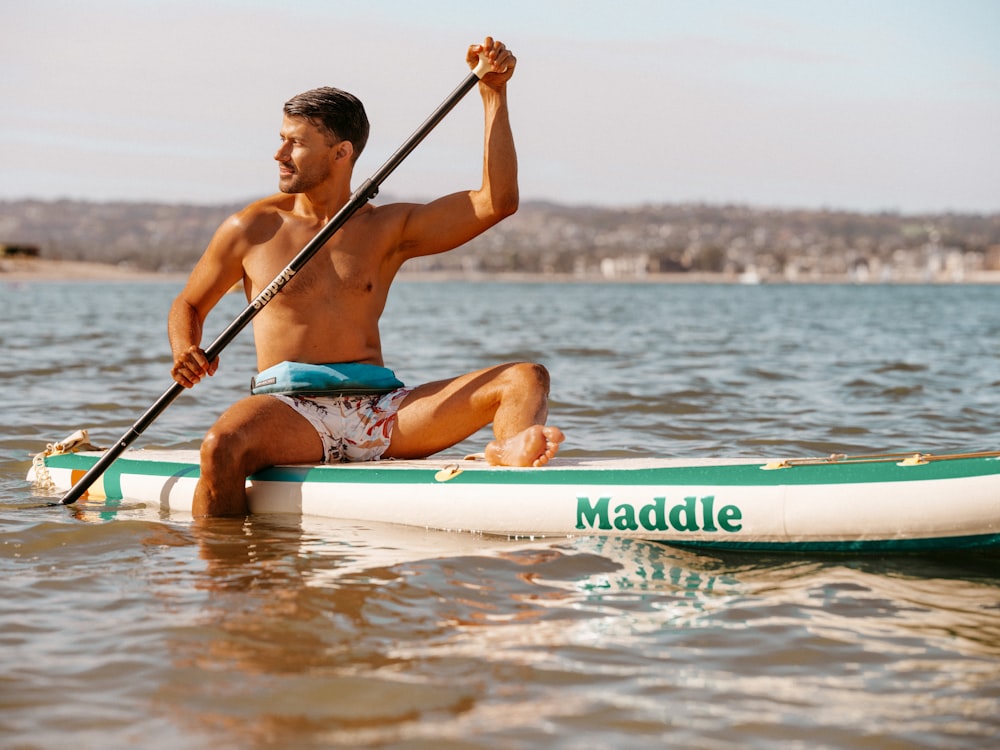 a man in a swimsuit on a surfboard