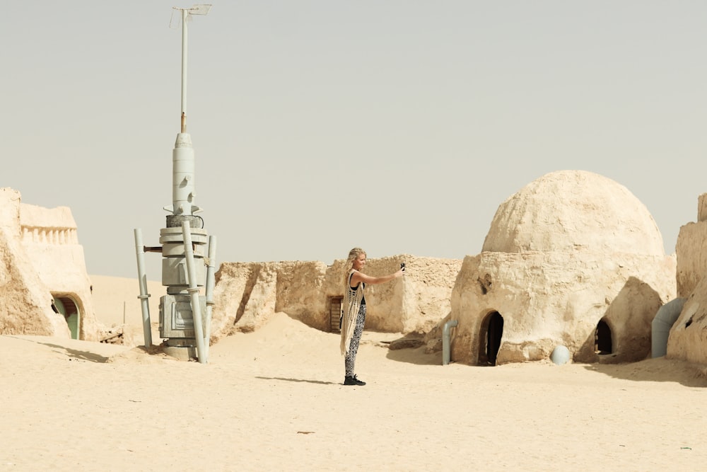 a man standing in a desert