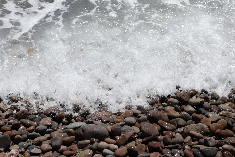 a rocky beach with waves crashing