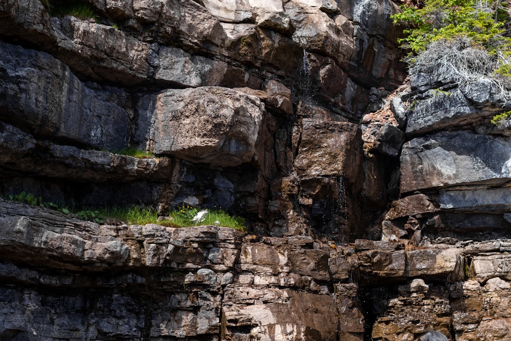 a rock wall with a hole in it