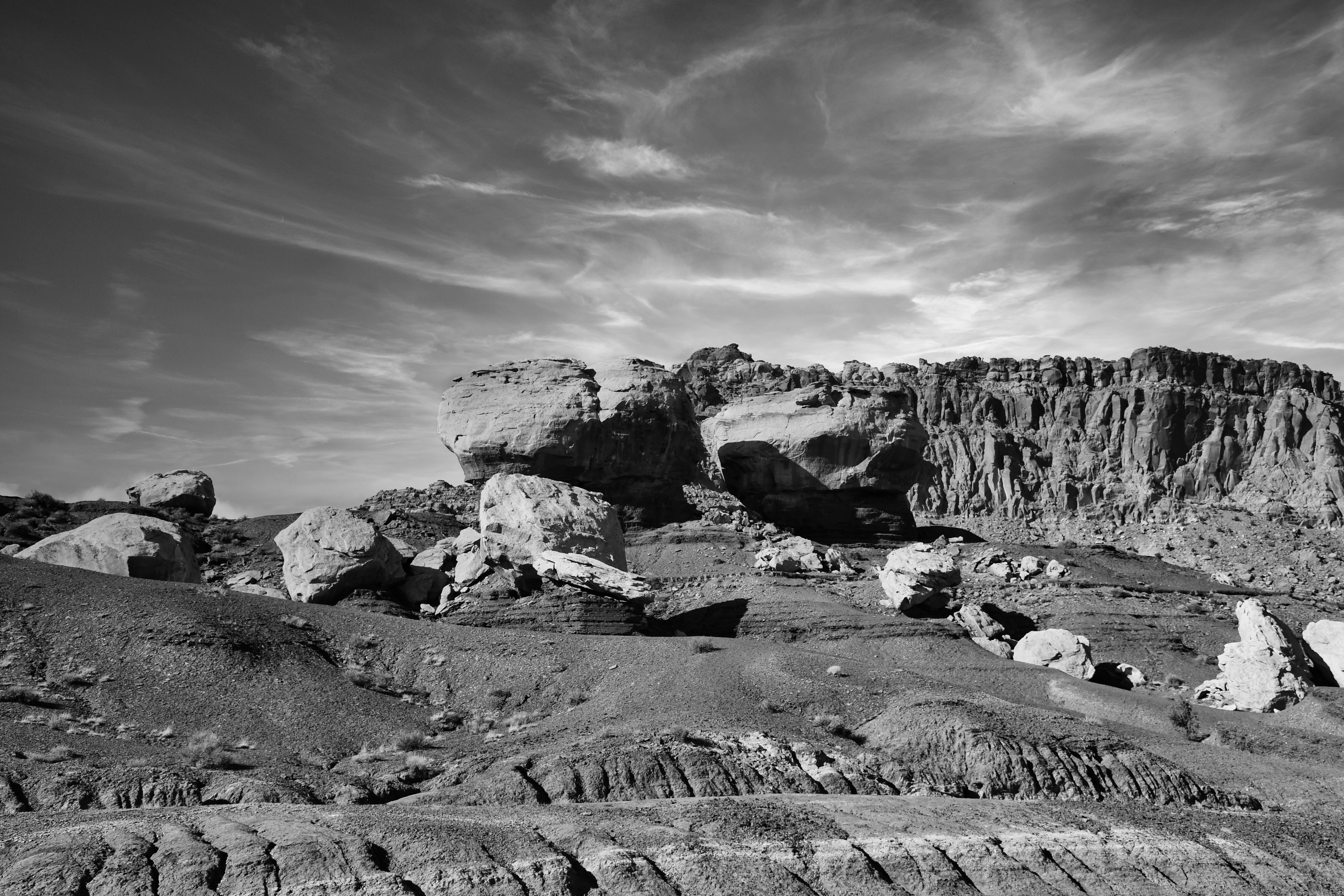 a rocky landscape with a cloudy sky