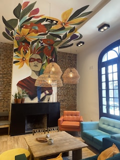 A bright living room adorned with colorful art murals.