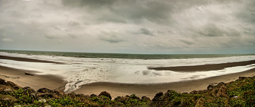 a beach with rocks and water