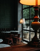 Interior view of Cafe Capsule LLC showing sleek capsule seating and warm lighting.