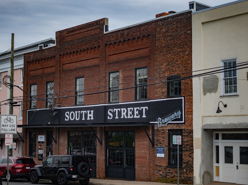 a brick building with a sign on it