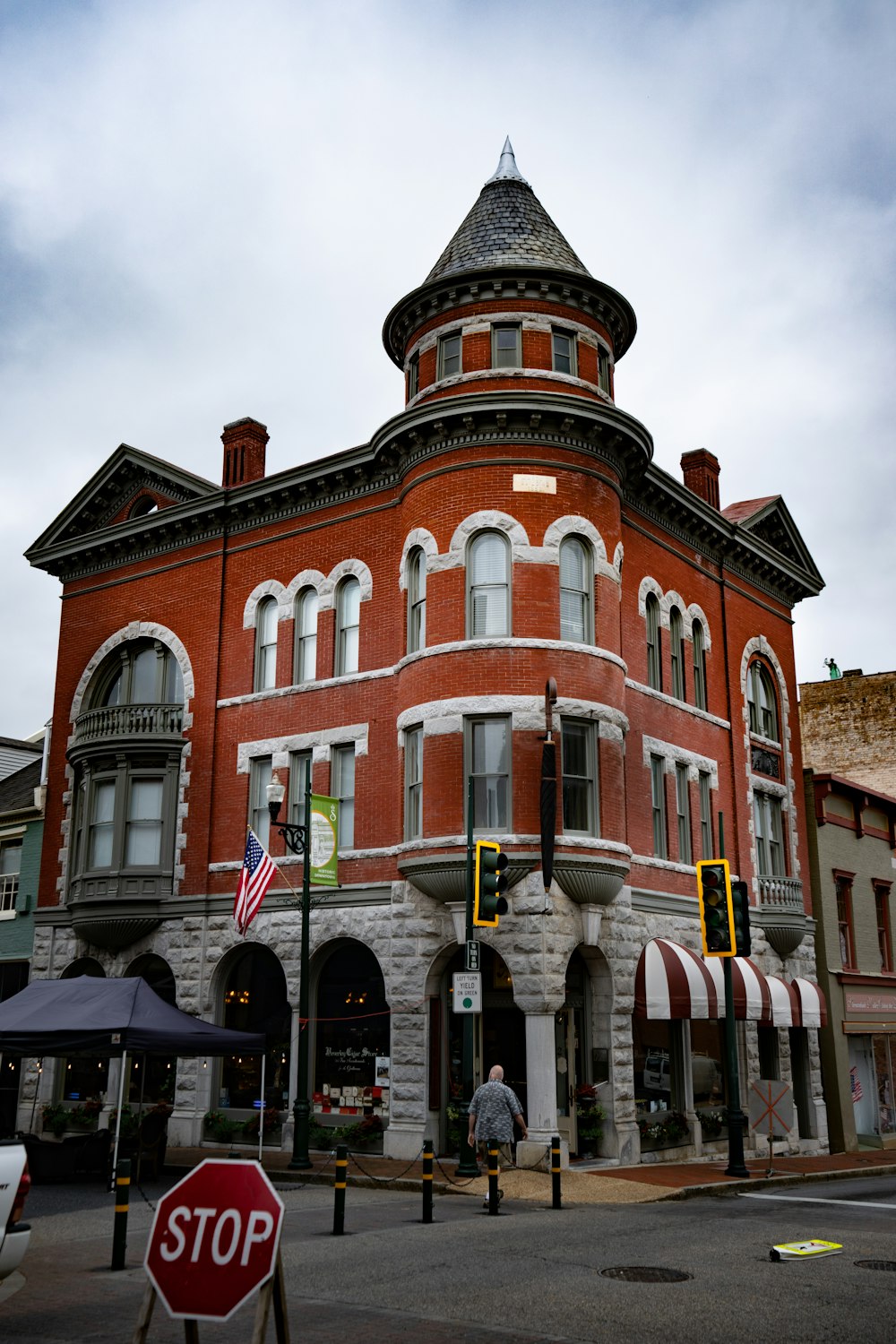 a large brick building with a flag on top