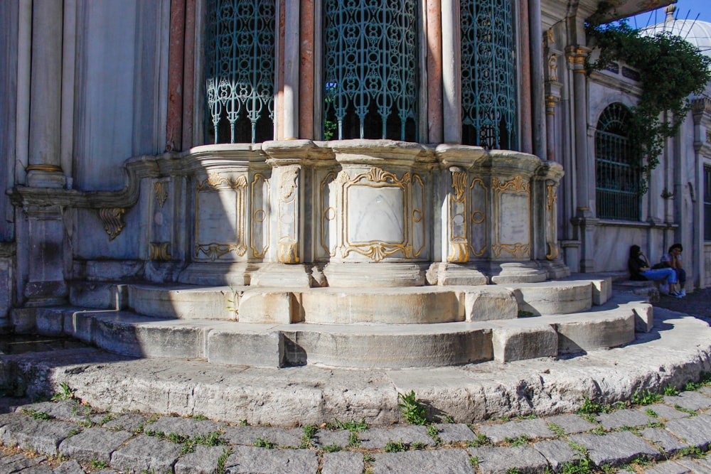 a stone monument in front of a building