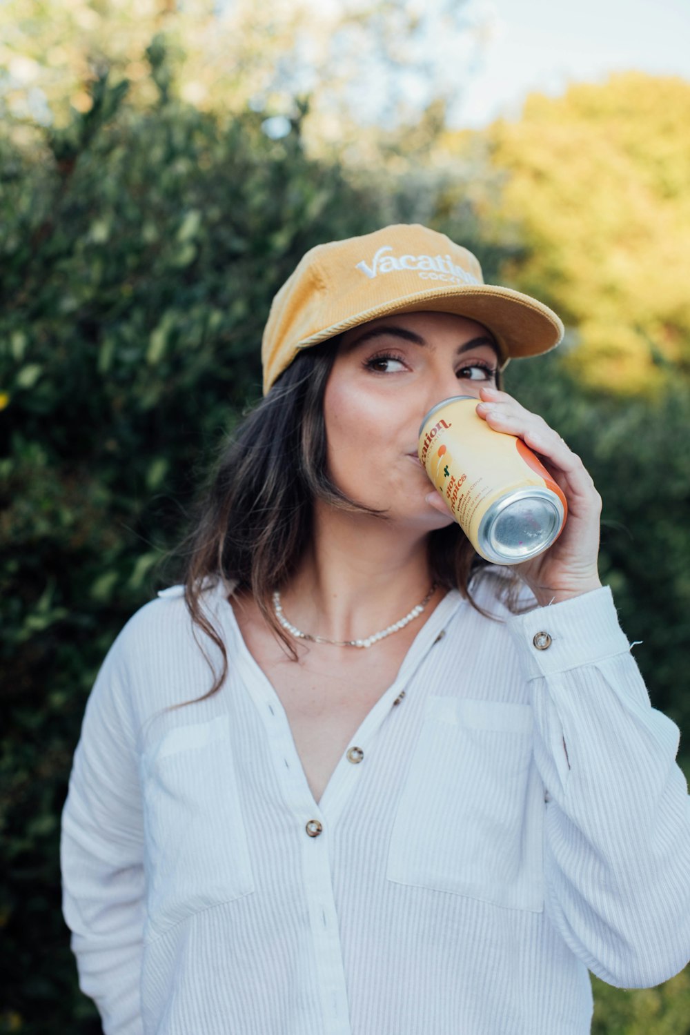 a person drinking from a glass