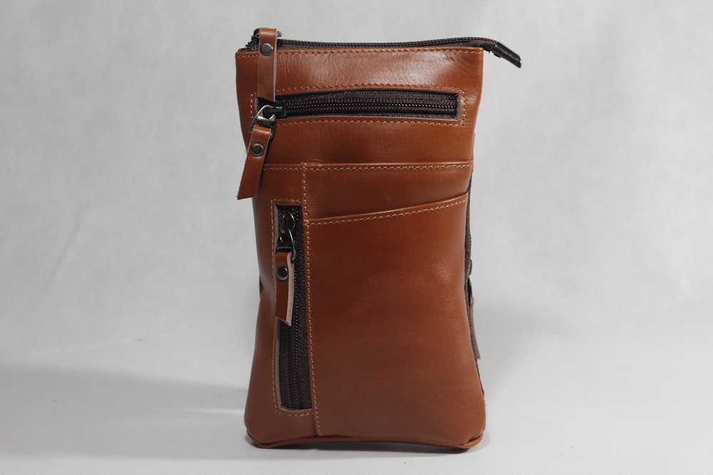 a brown leather purse