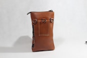 a brown leather purse