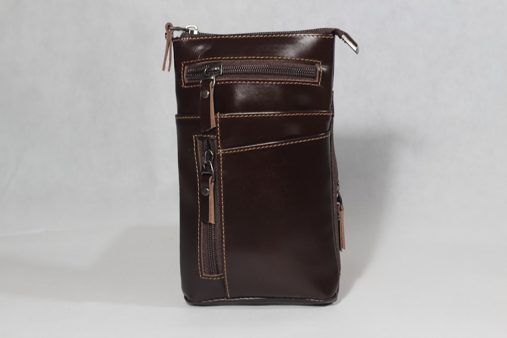 a brown leather purse