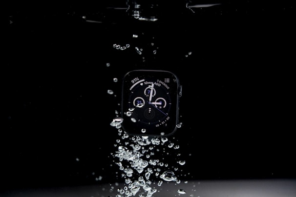 Brave model smartwatch submerged in water, highlighting its swimming mode and waterproof design.
