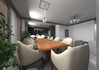 a room with a table chairs and a plant